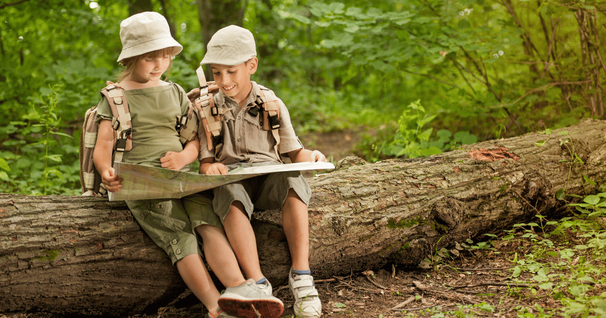 Children dressed in designated clothing with equipment for camping