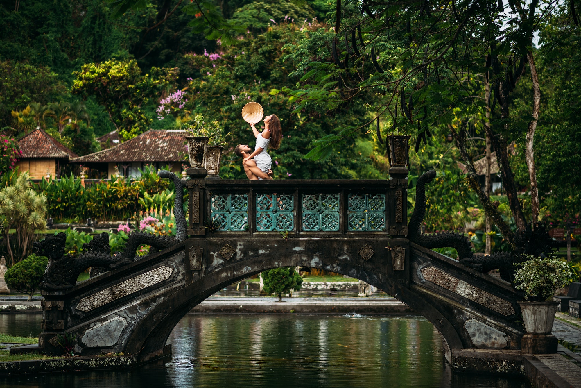 A couple at the Tirta Ganga water Palace in Bali, Indonesia