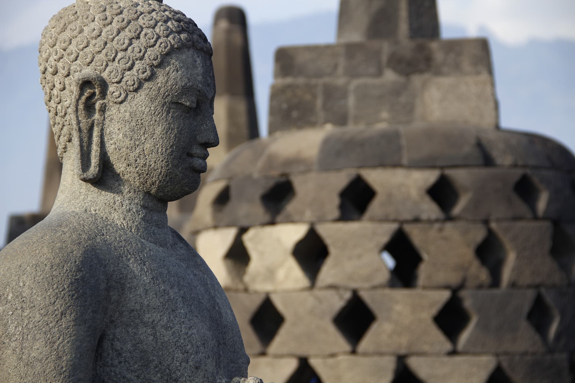 A figure of a winged face of the bells in The Borobudur Temple. Indonesia