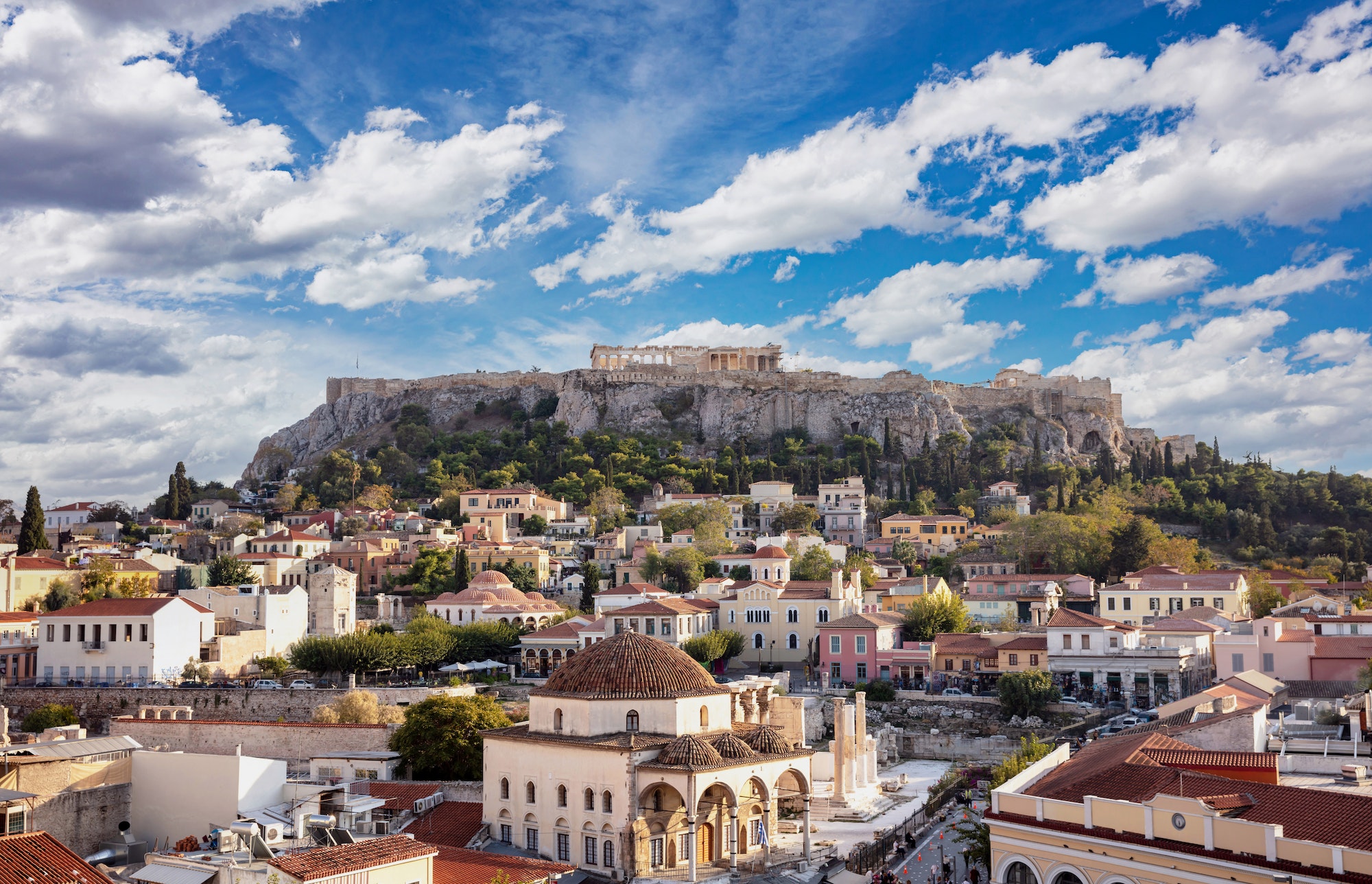 Aerial panoramic view of Monastiraki square and the Acropolis in Athens, Greece.