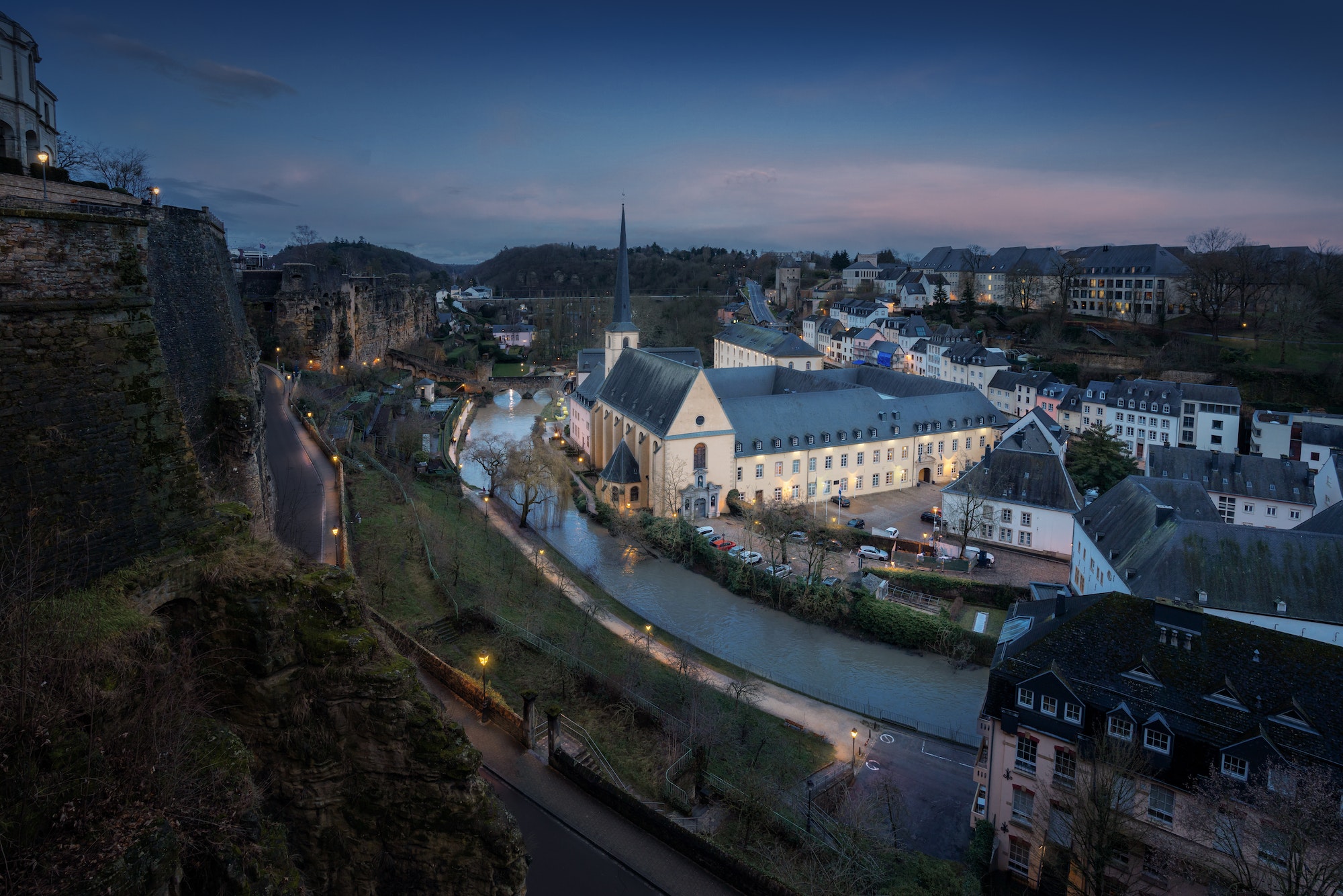 Aerial view of The Grund with Neumunster Abbey at night - Luxembourg City, Luxembourg