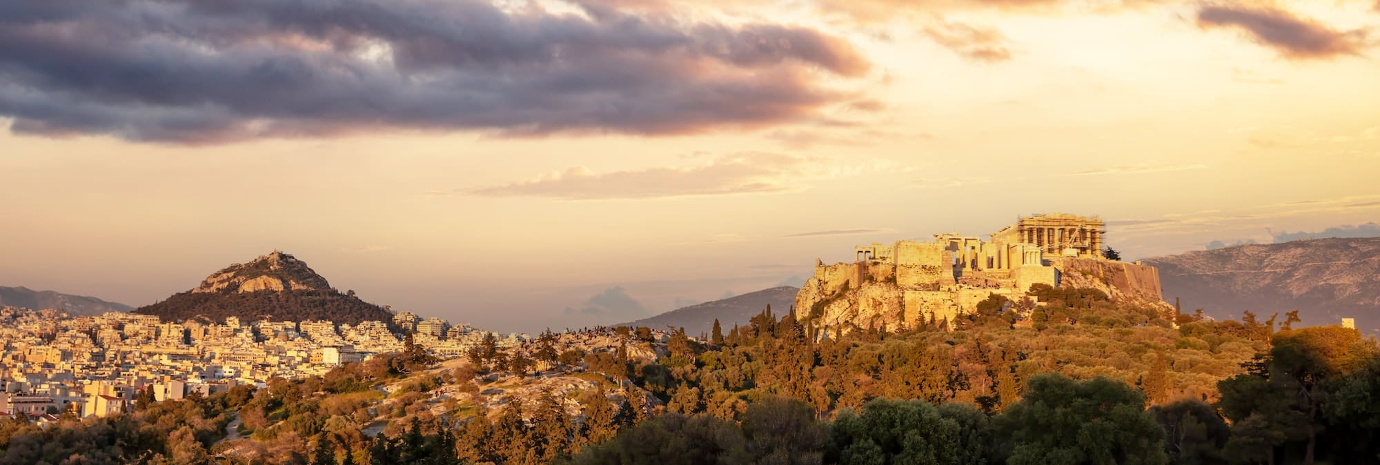 Athens, Greece. Acropolis of Athens and Mount Lycabettus panorama from Areopagus hill at sunset