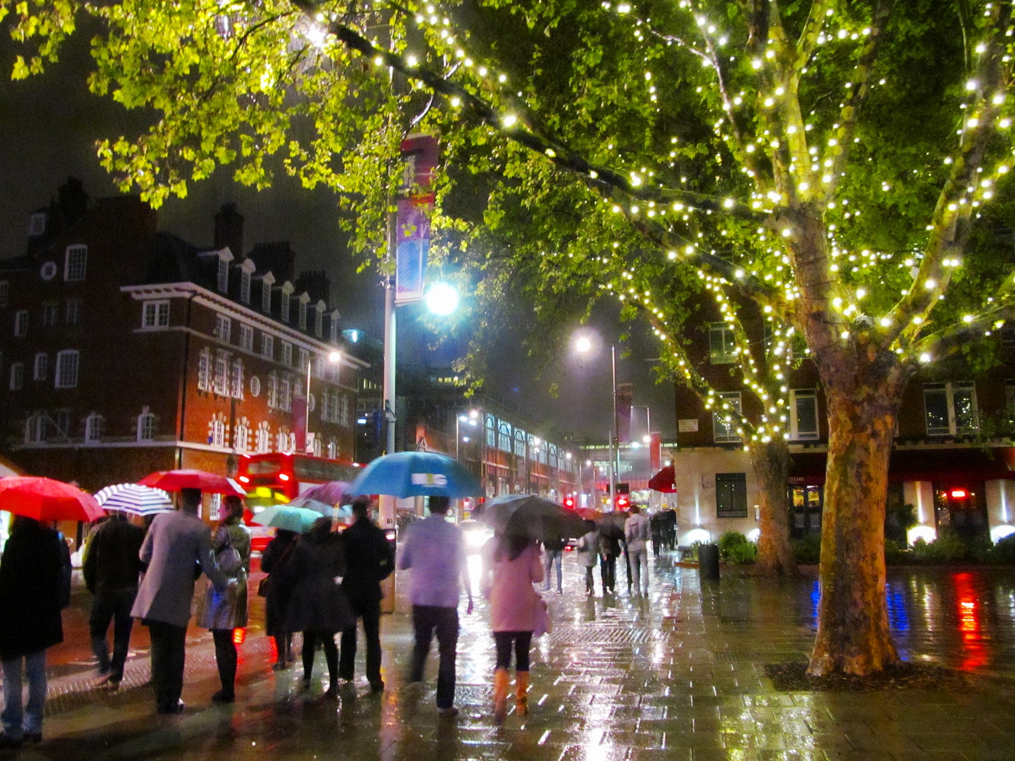busy rainy day in London at night