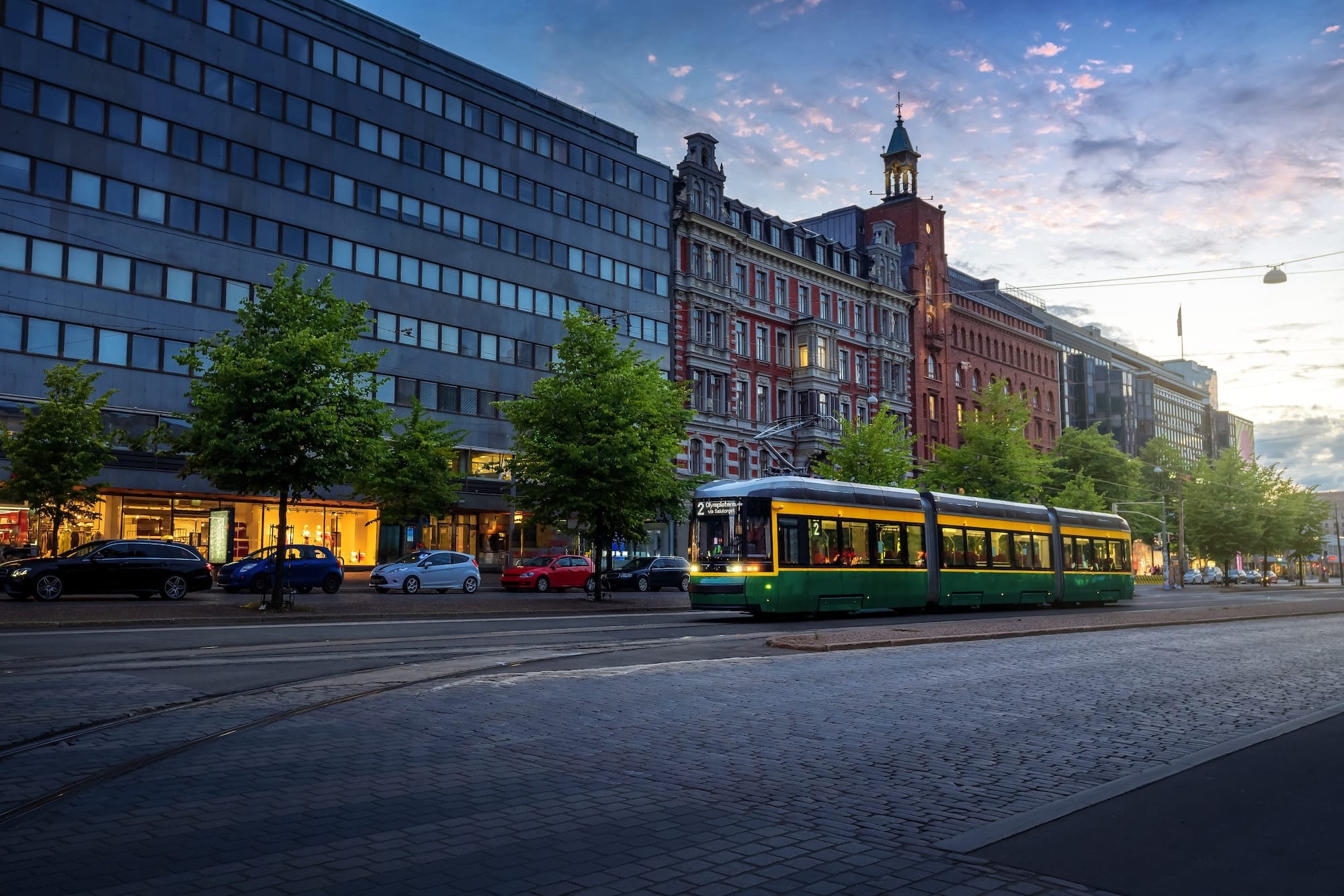 City Tram in Mannerheimintie Street at sunset - Helsinki, Finland