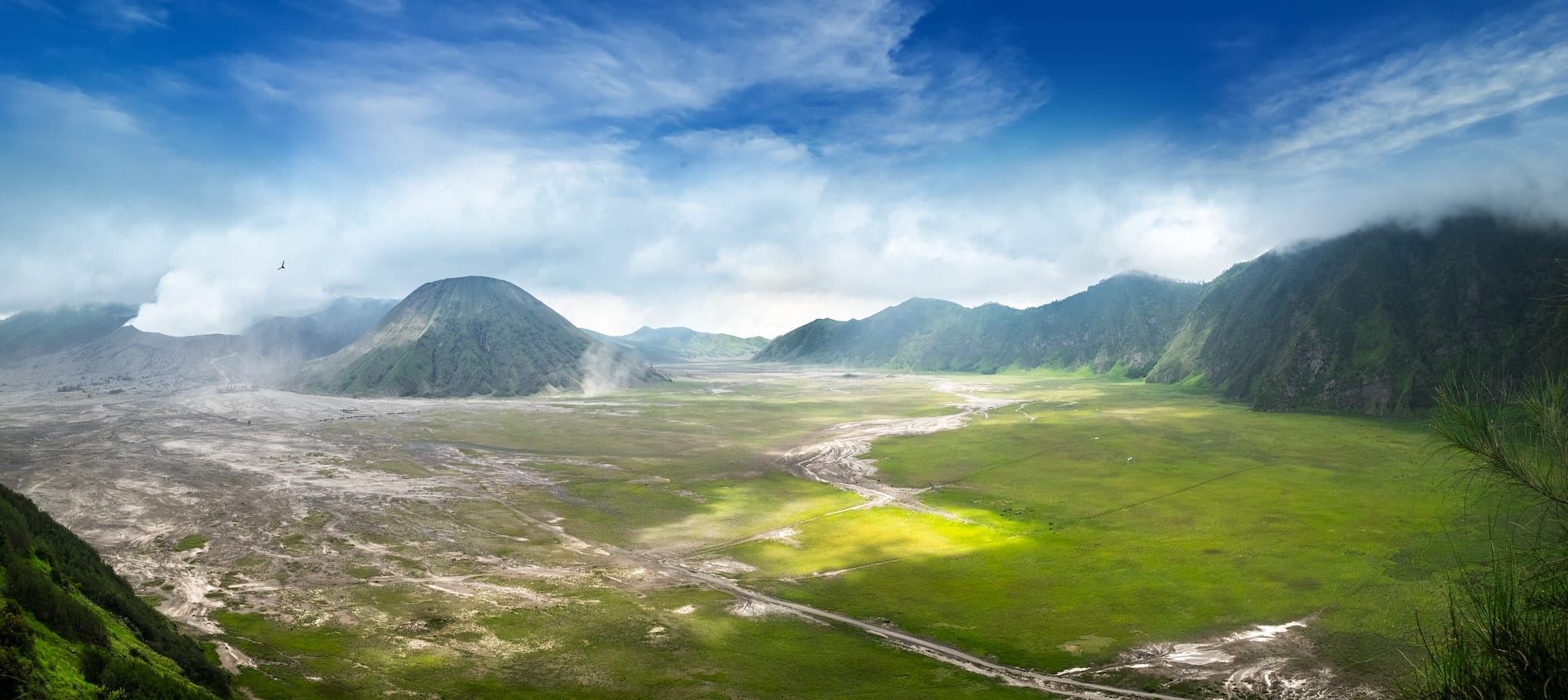 Clouds of thick white smoke emitted by erupting volcano. Mount Bromo. Indonesia