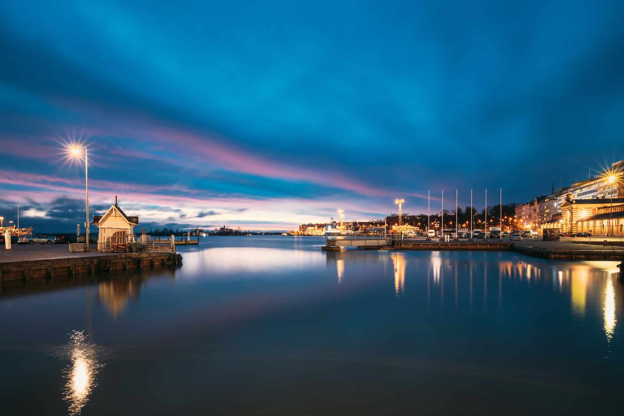 Helsinki, Finland. Landscape With City Pier, Jetty At Winter Sunrise Sunset Time. Blue Sky Reflected