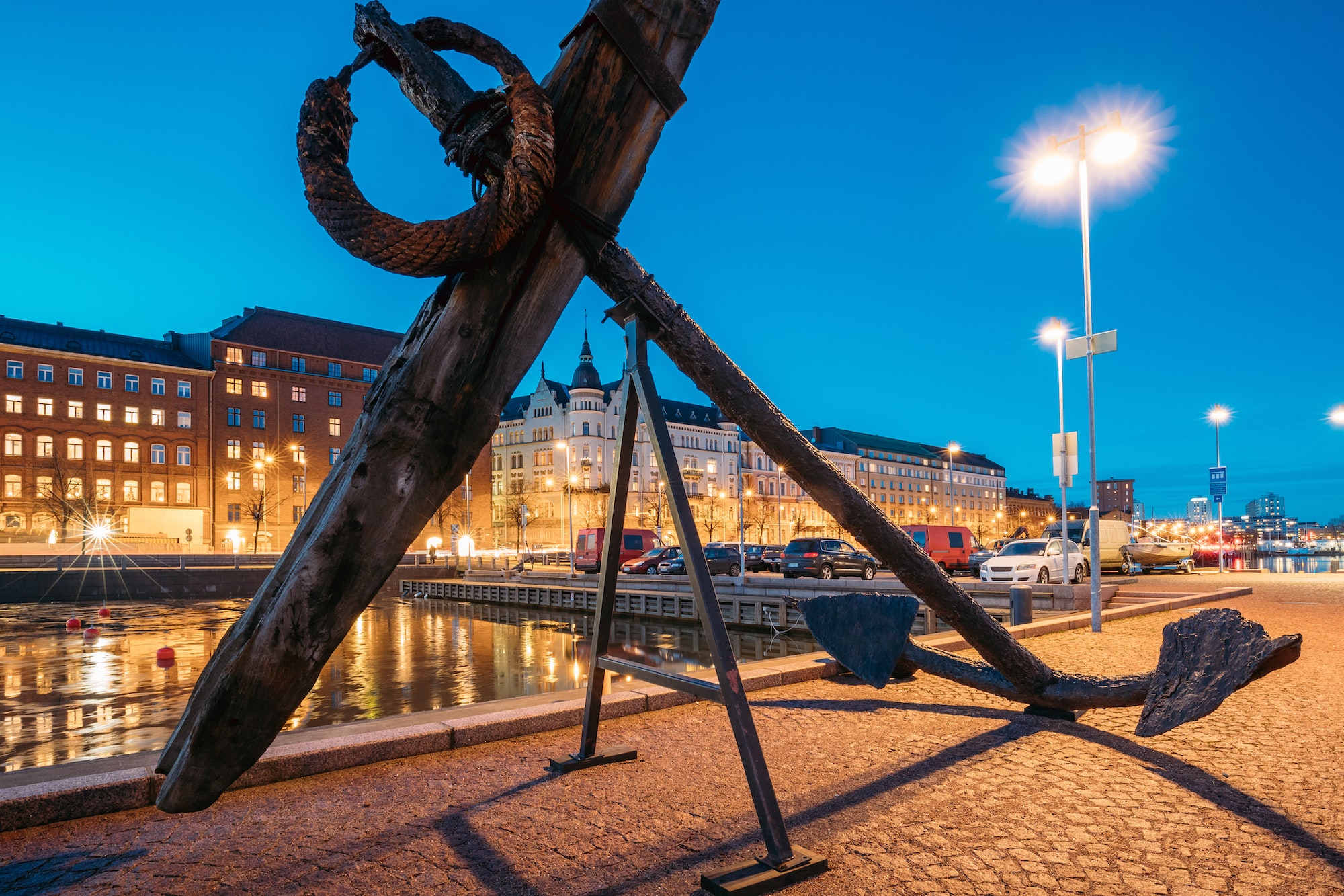Helsinki, Finland. Old Anchor On Pier With View Of Pohjoisranta