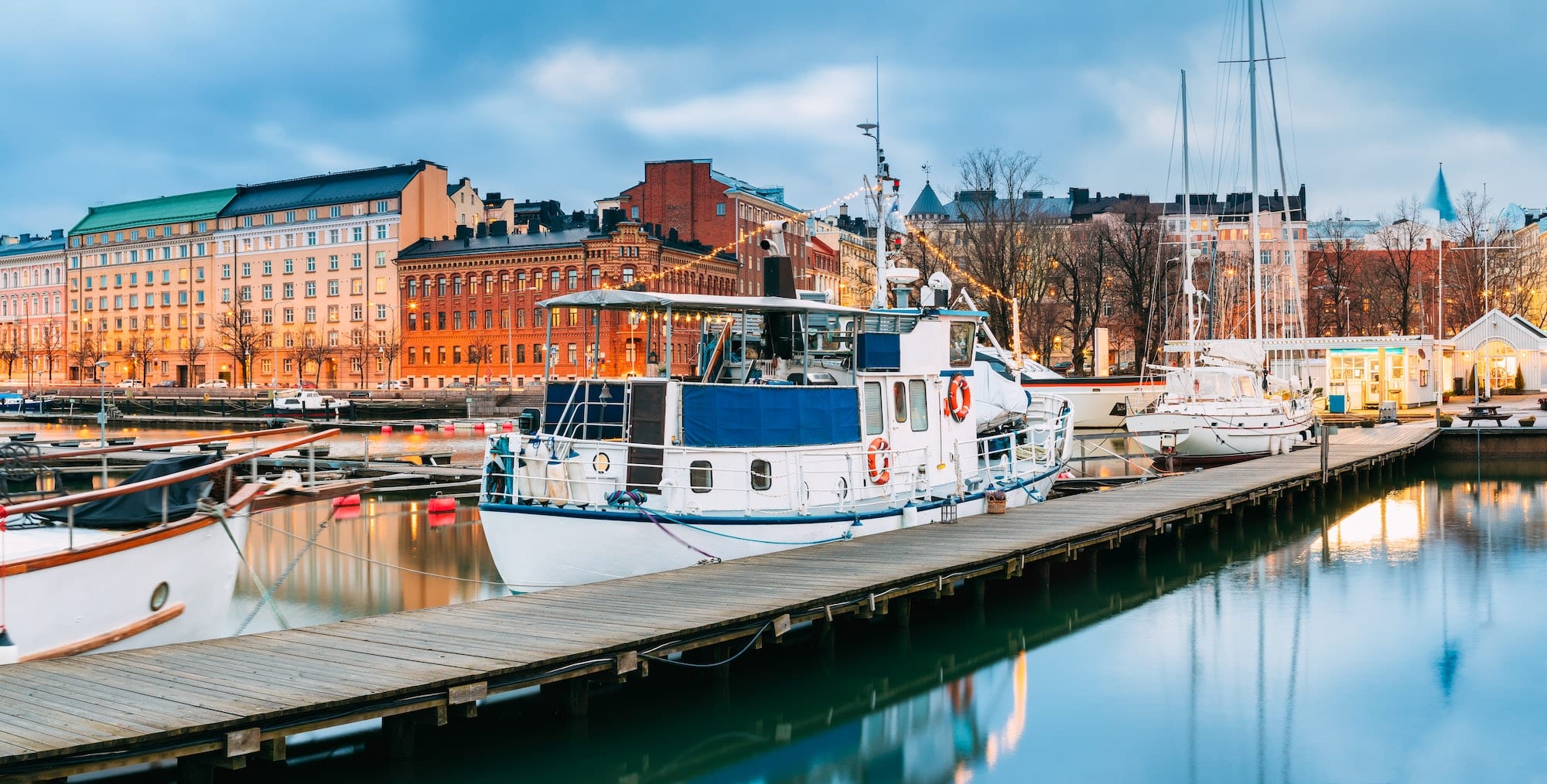 Helsinki, Finland. Pleasure Boat In Evening Illumination At The