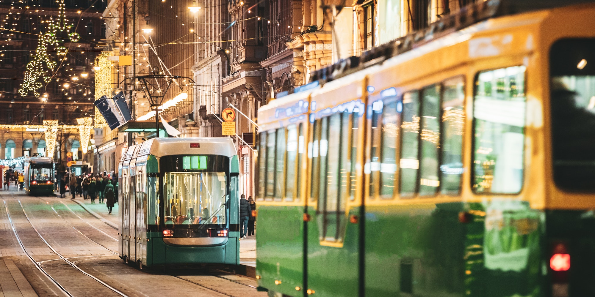 Helsinki, Finland. Tram Departs From Stop On Aleksanterinkatu Street. Night Evening Christmas Xmas
