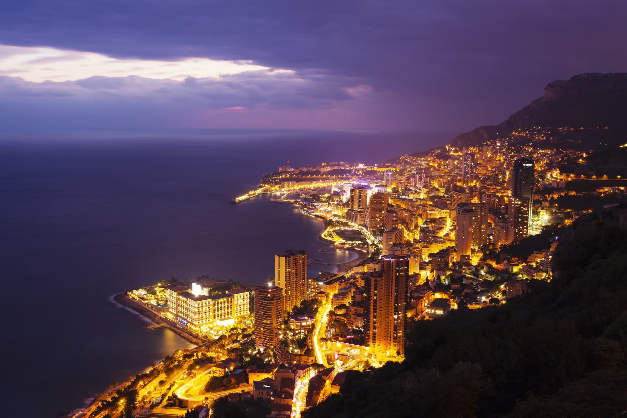 High angle view of Monte Carlo city lights at night, Monaco