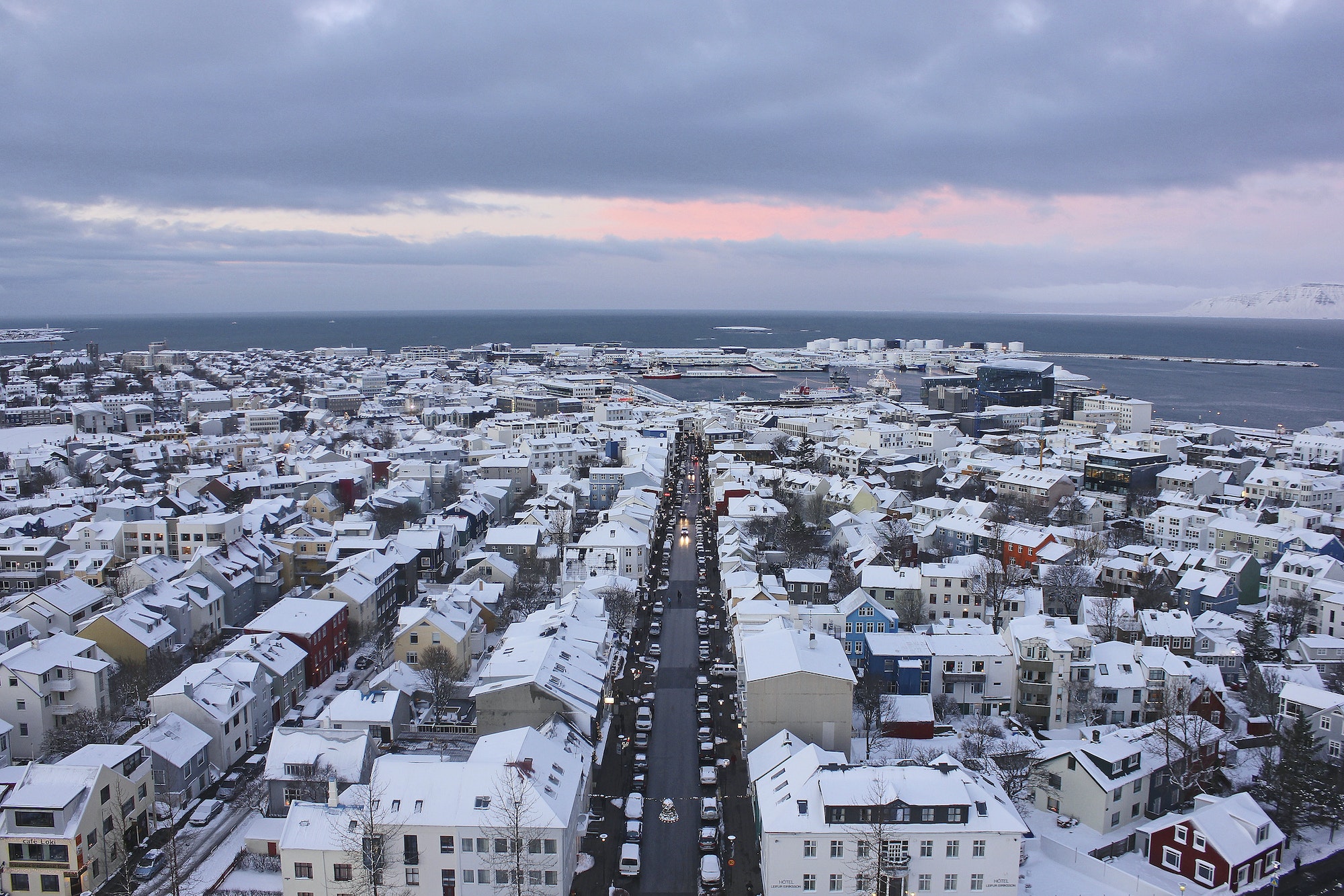 Looking down on Sunset over snow covered reykjavik