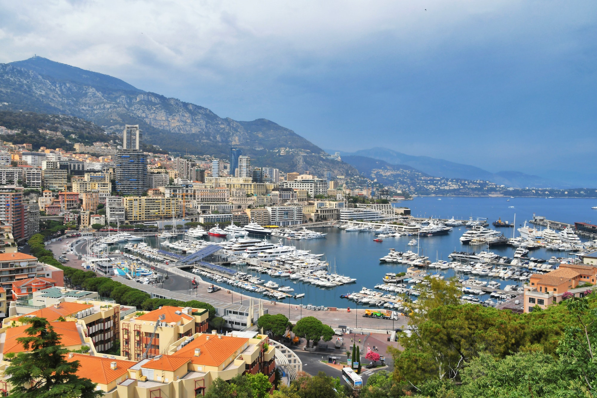 Luxury yachts boats in the harbor marina of Monte Carlo Monaco. European cityscape