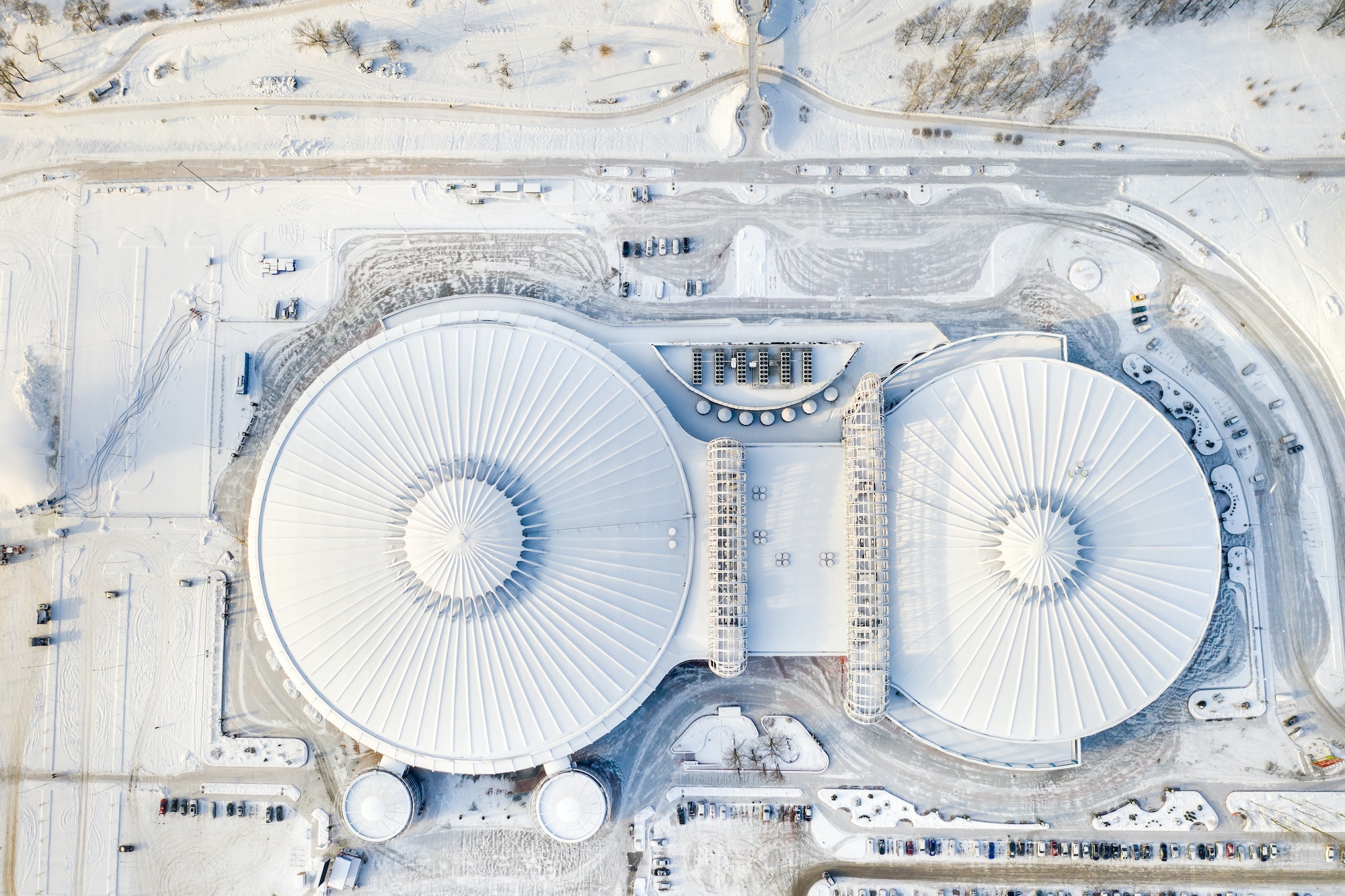 Top view in winter of a modern sports complex with parking in Minsk. Belarus