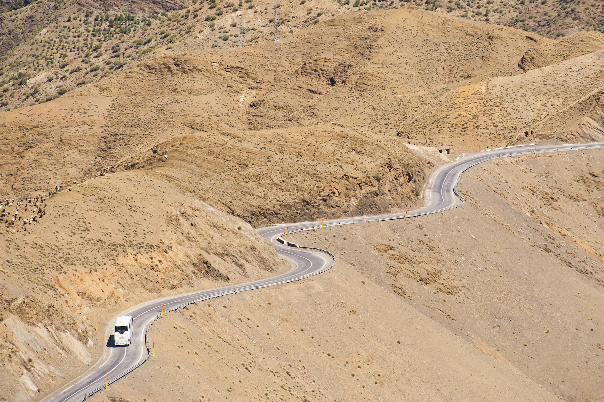 Tourist bus driving in the High Atlas Mountains just outside Marrakech on the Tizi n Tichka pass, Mo