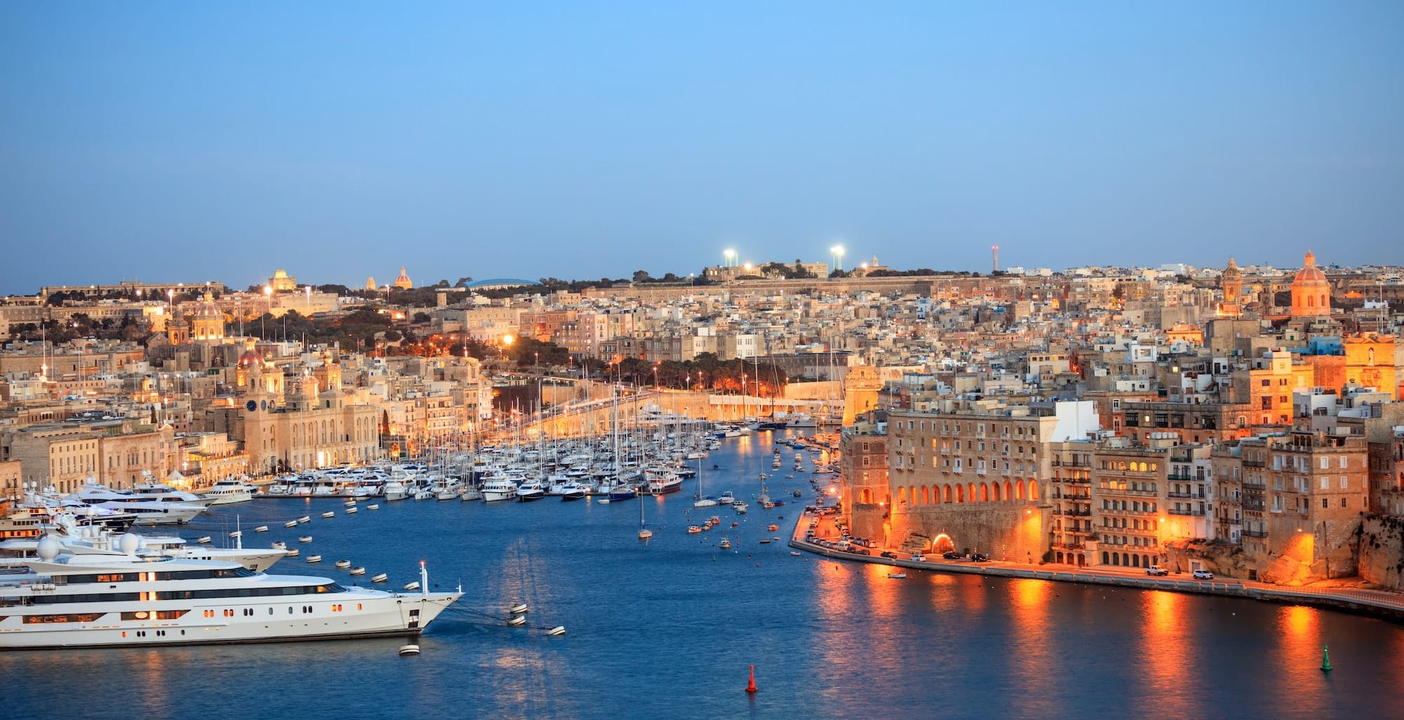 Valletta, Malta. View of Grand harbor from Upper Barrakka Gardens in the evening