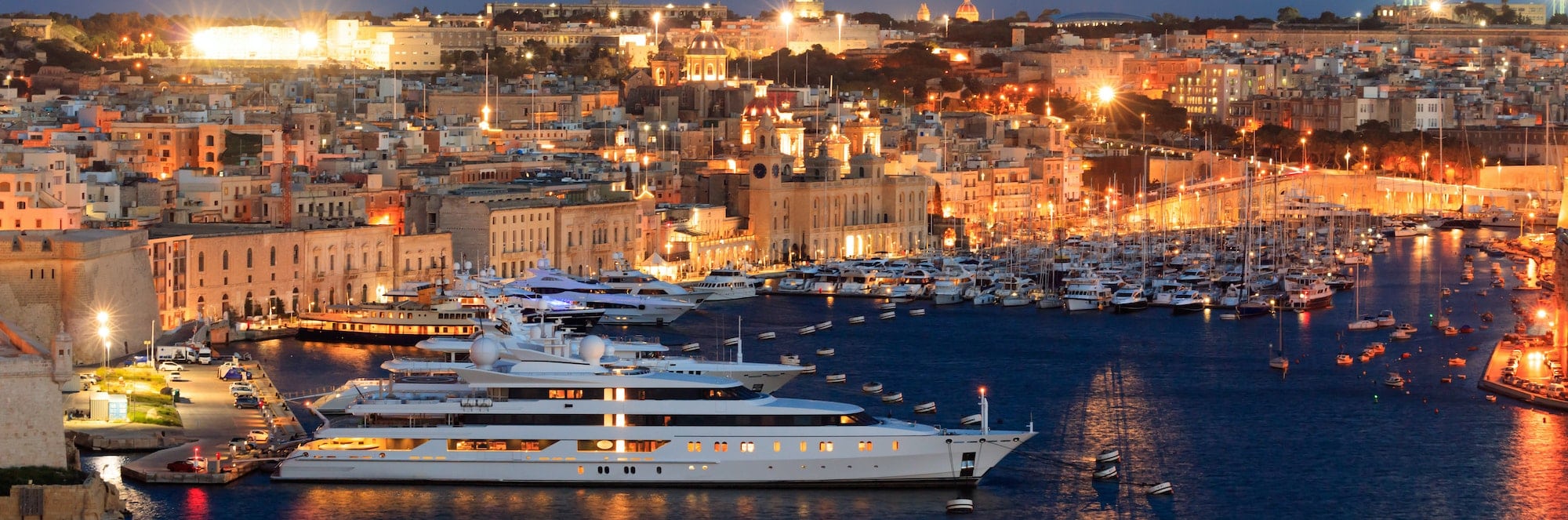 Valletta, Malta. View of Grand harbor from Upper Barrakka Gardens in the evening