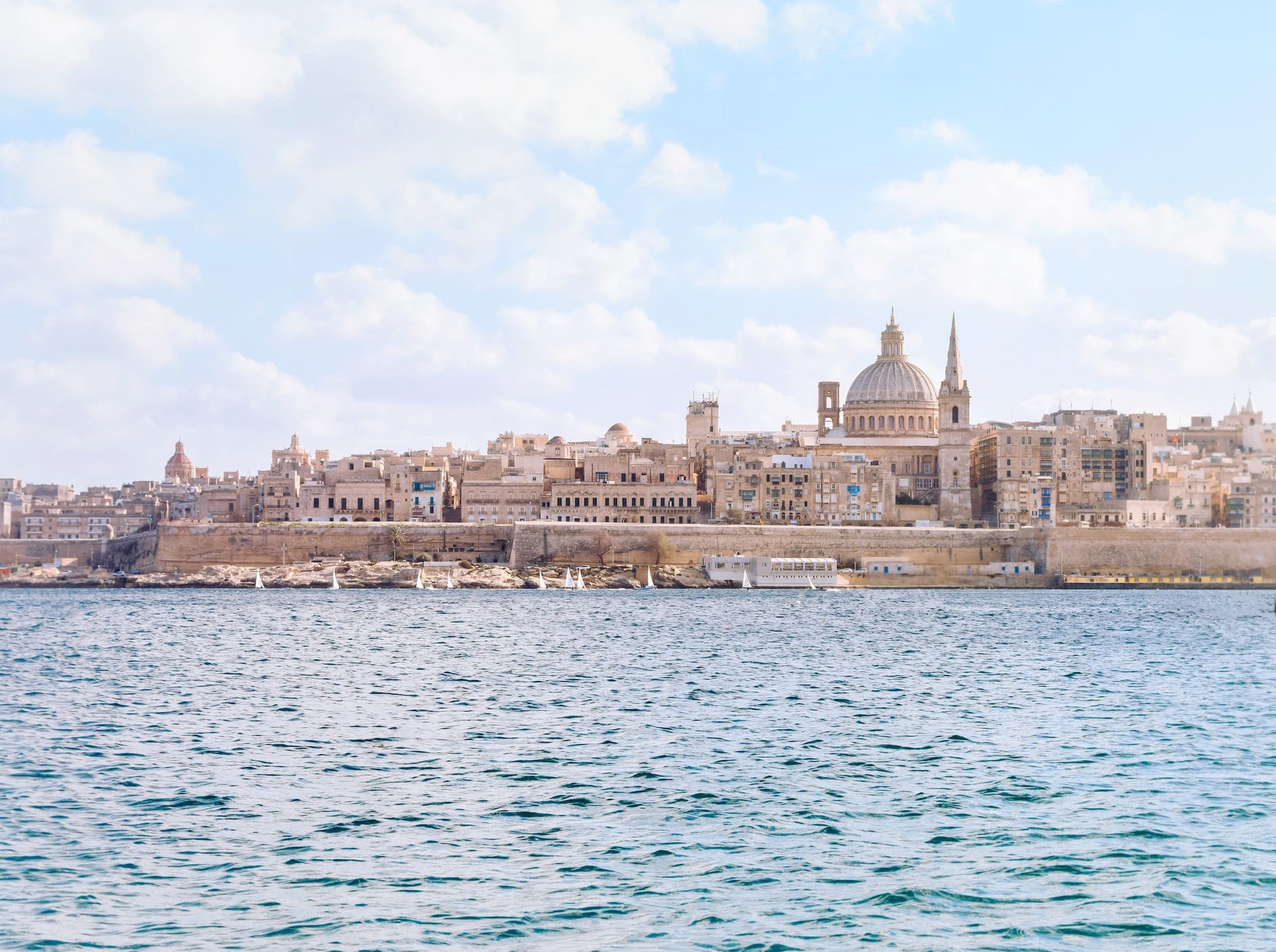 View of the city of Valletta in the soft morning light with pastel shades.