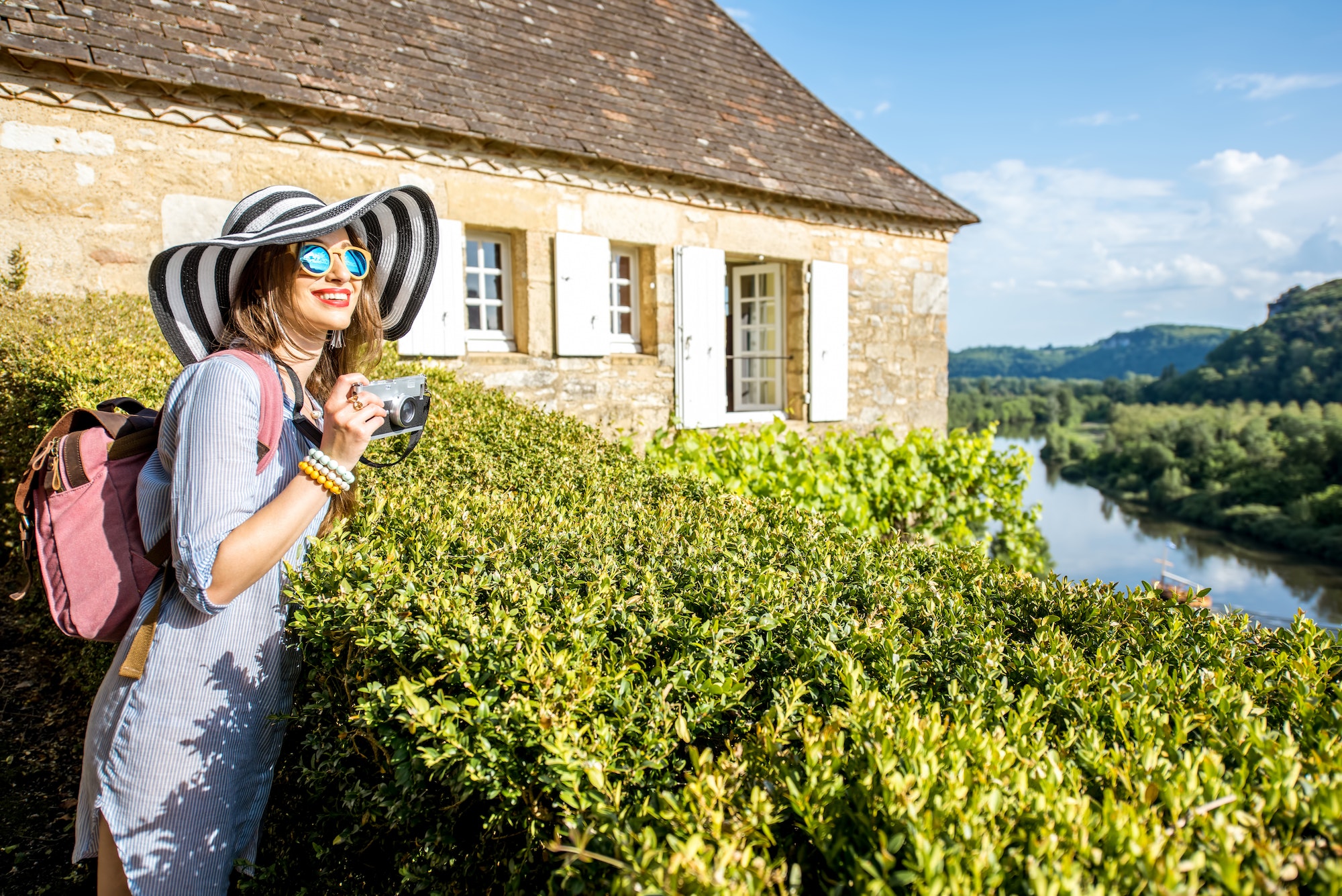 Woman traveling in La Roque Gageac village, France