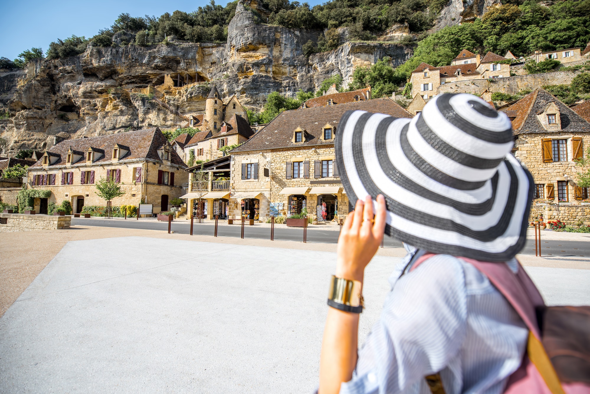 Woman traveling in La Roque Gageac village, France