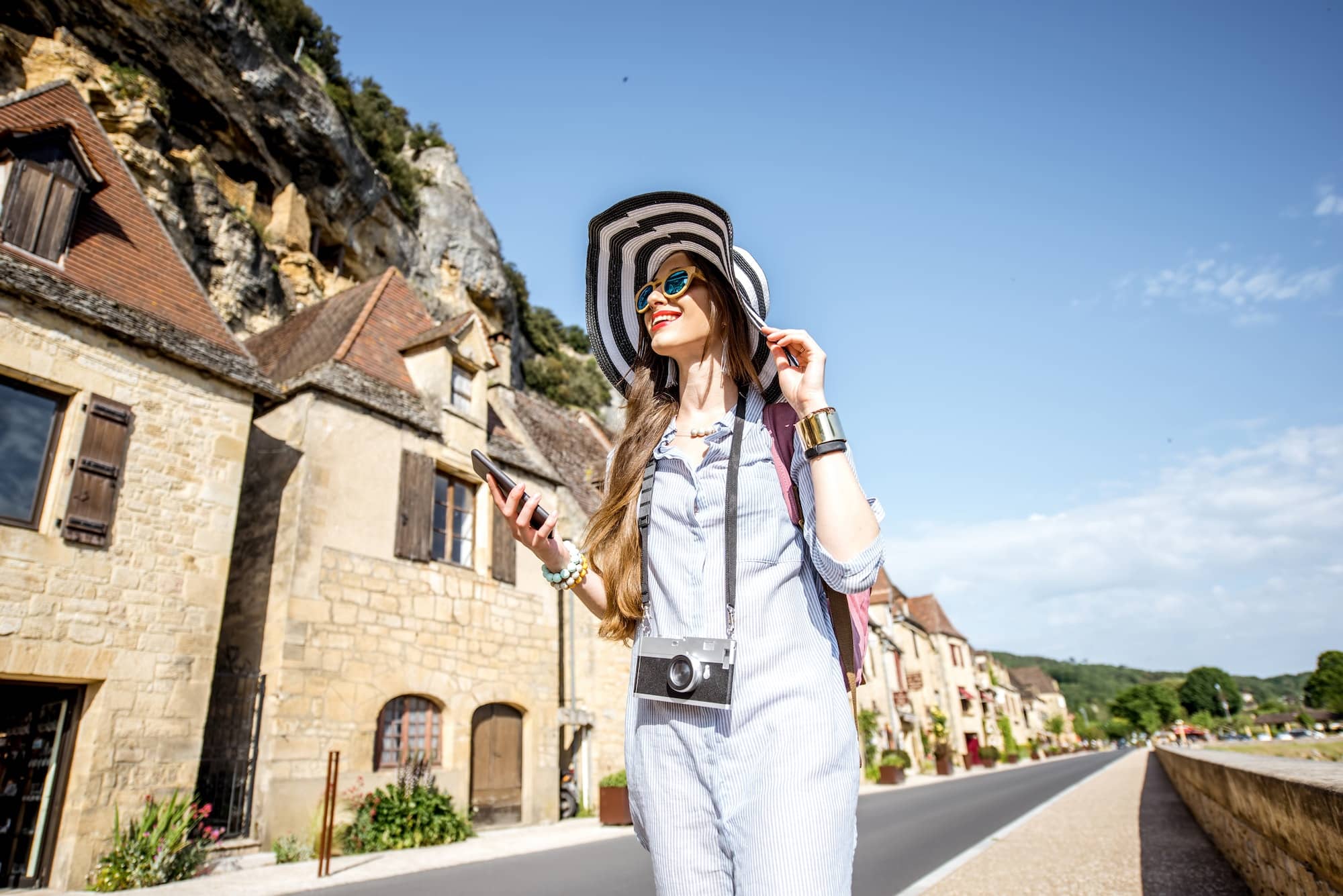 Woman traveling in La Roque Gageac village, France