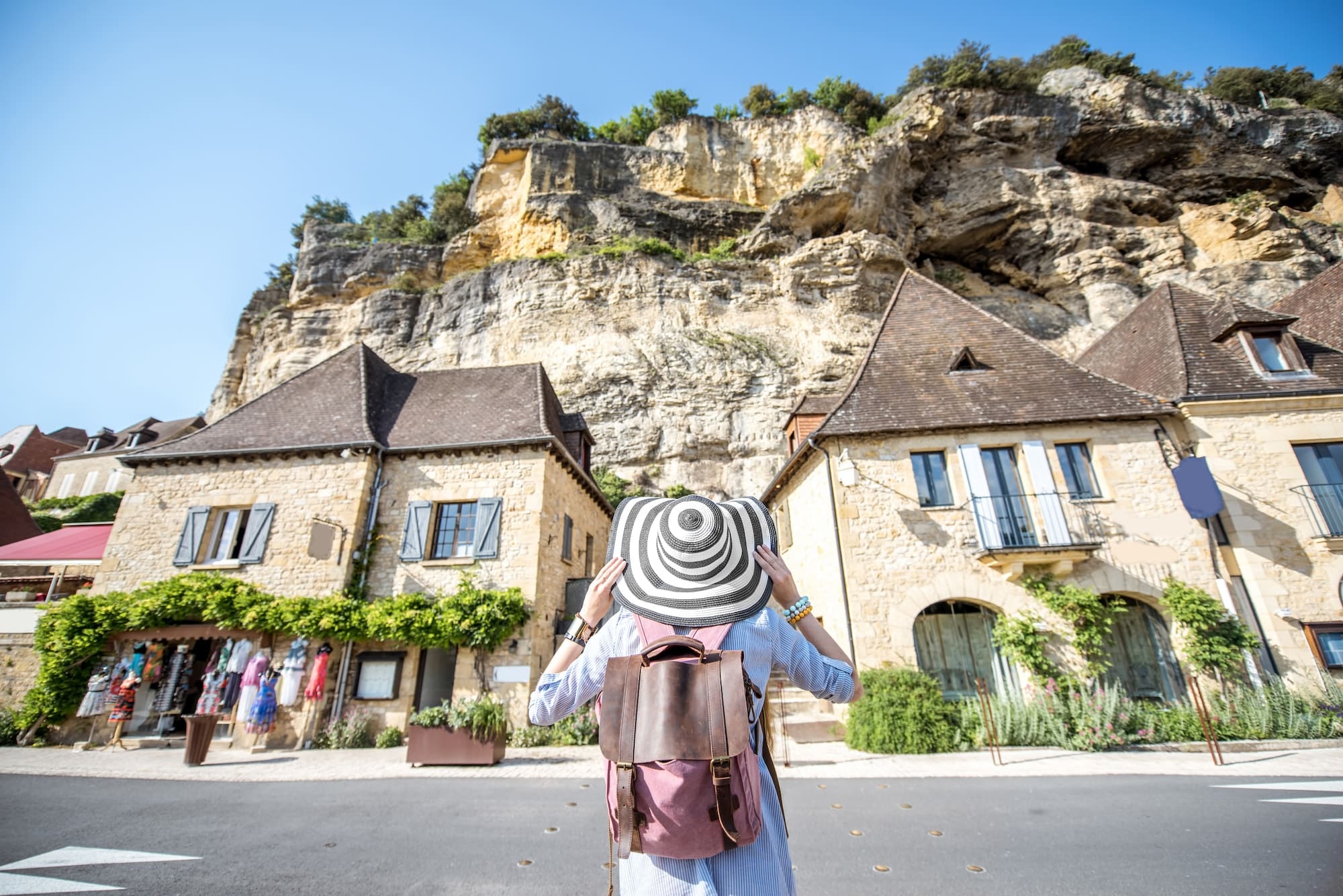 Woman traveling in La Roque Gageac village, France