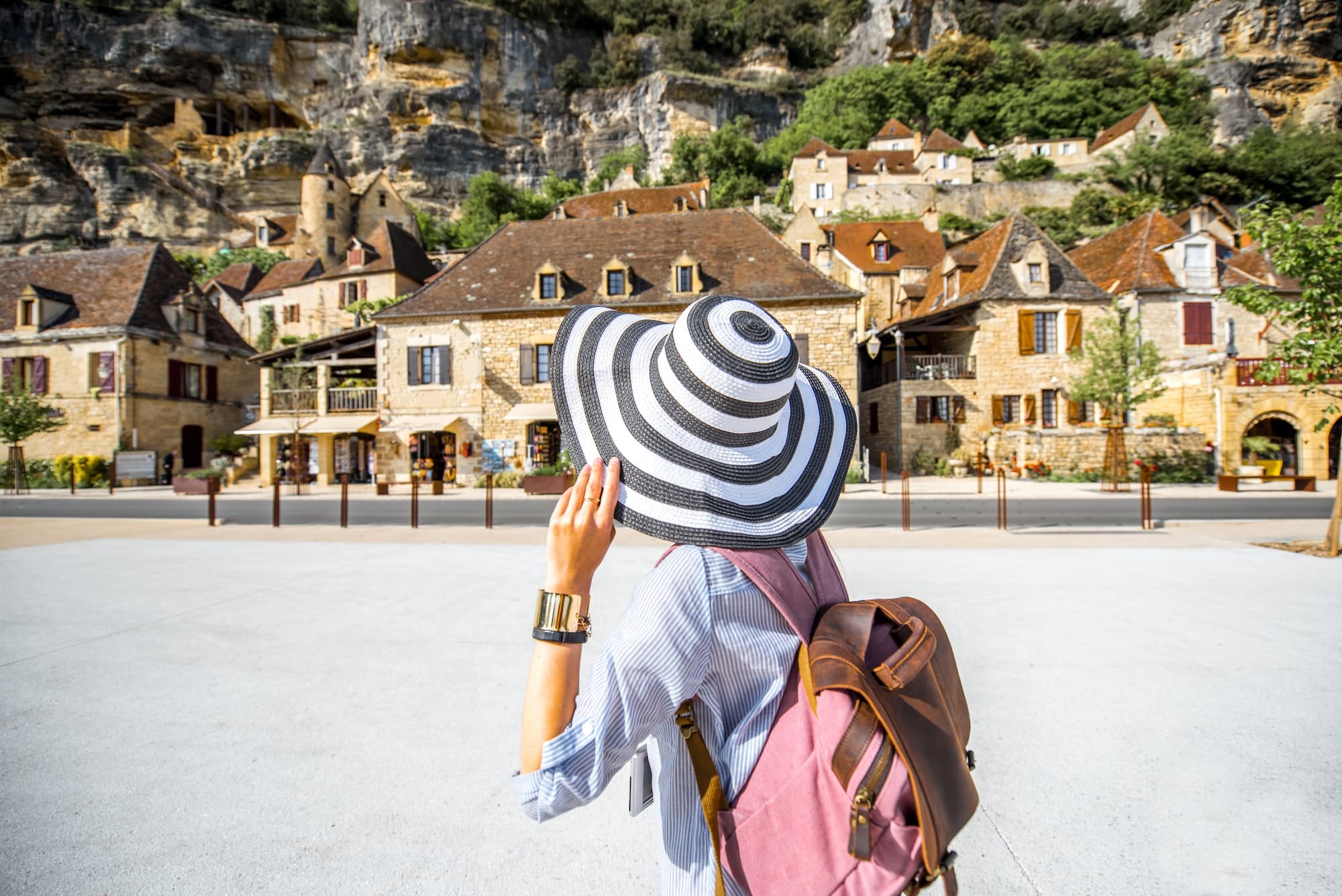 Woman traveling in La Roque Gageac village, France