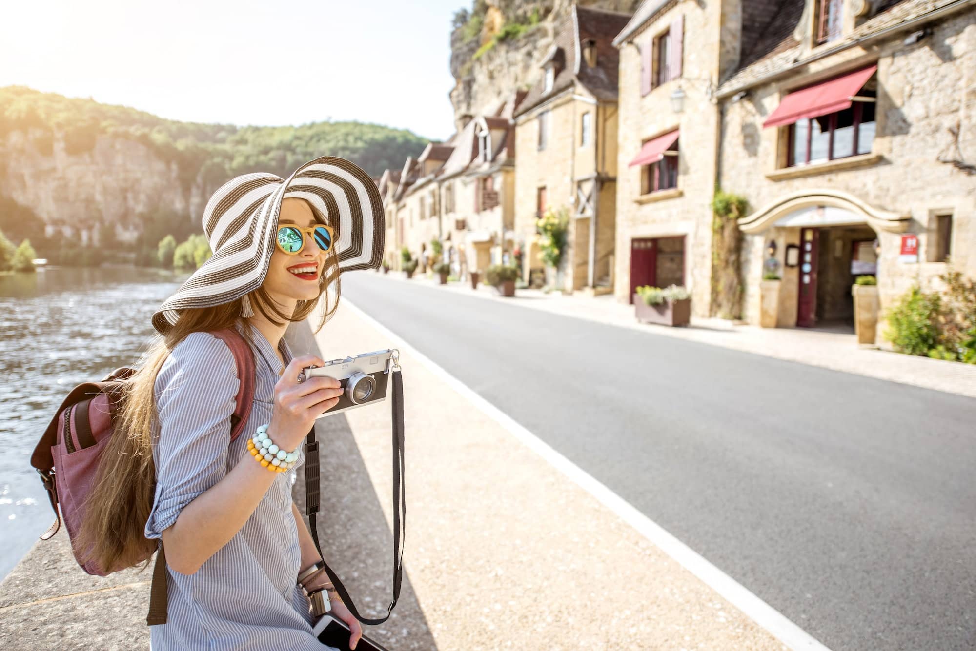 Woman traveling in La Roque Gageac village, France