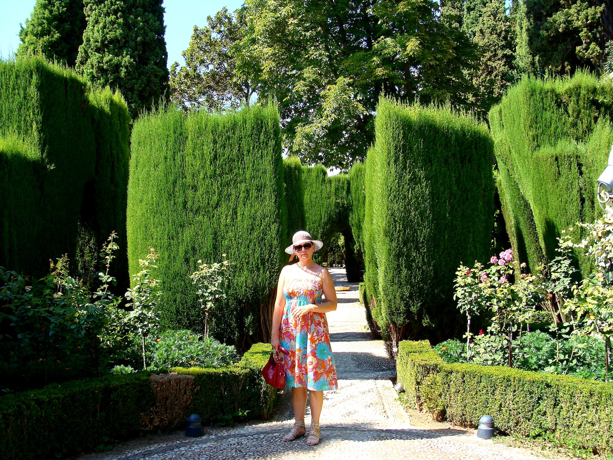 Woman visiting gardens in Madrid Spain