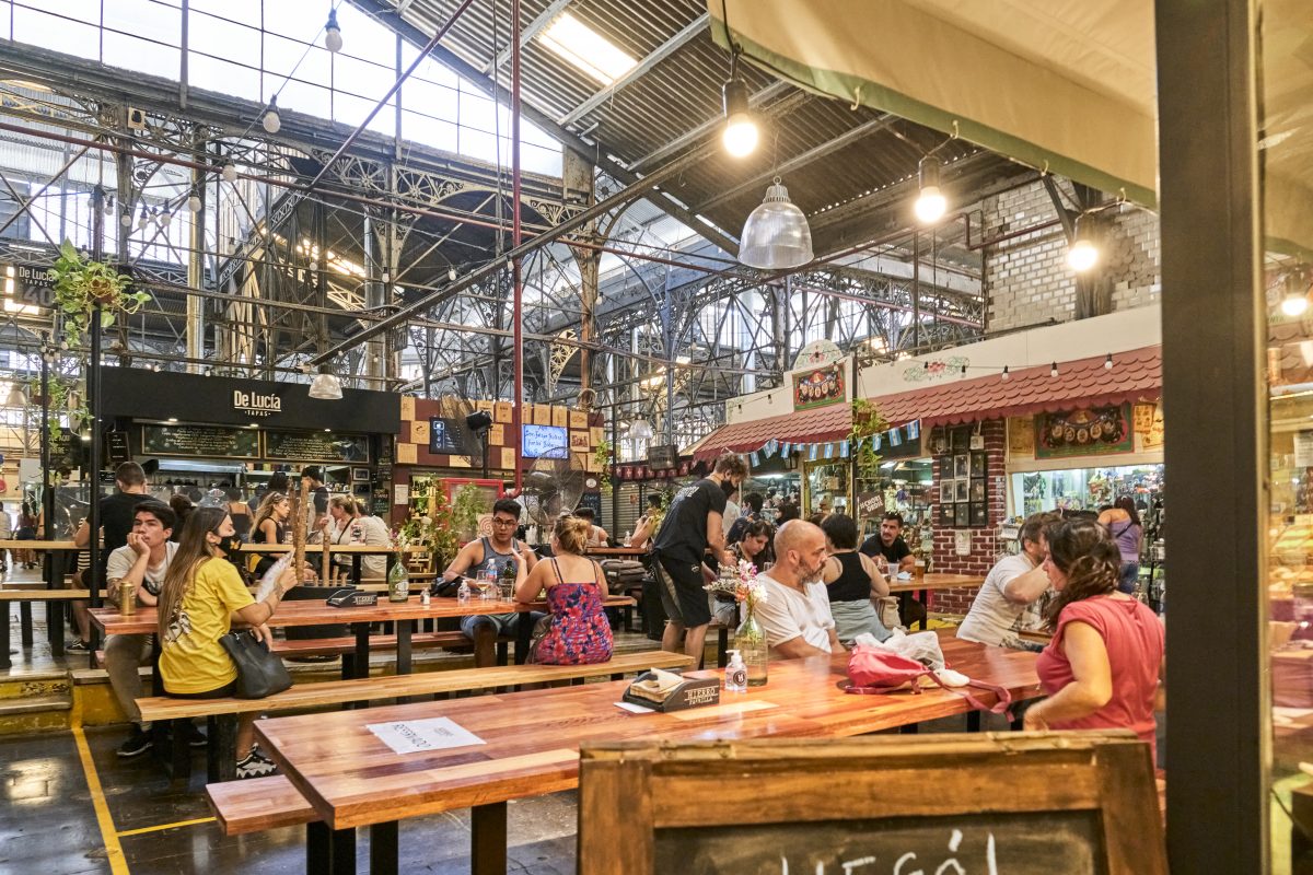 Buenos Aires, Argentina; Jan 24, 2021: people in the food court inside the San Telmo Market, a large indoor market of great importance as a tourist attraction